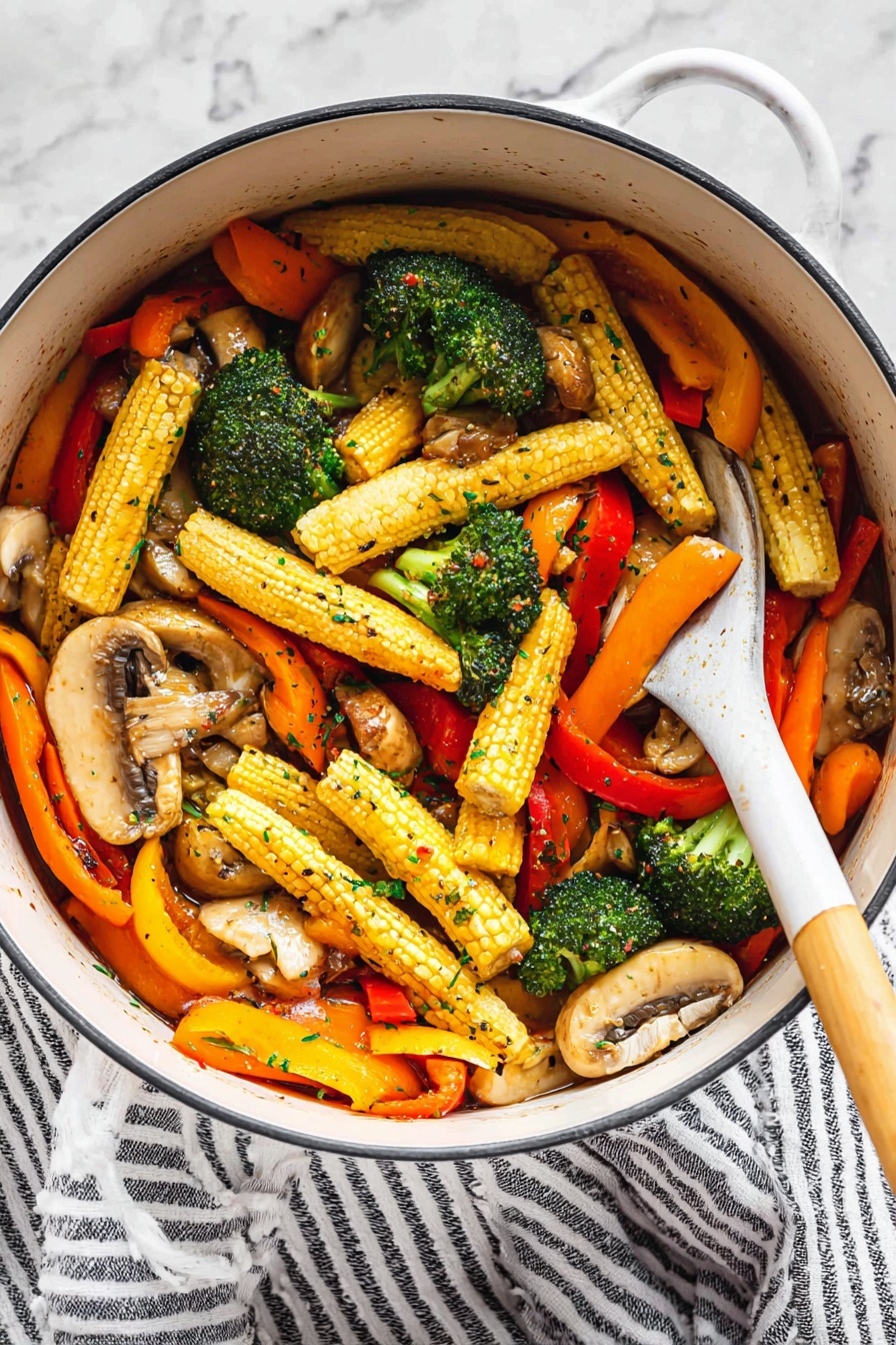 Vegetable Stir Fry with Garlic, Ginger, and Savory Sauce, healthy vegetable stir fry, quick stir fry recipe, flavorful vegetable stir fry, easy vegetarian dinner - A white pot holds a colorful mix of vegetables with three main layers: at the bottom are light brown sliced mushrooms with a tender texture, the middle layer shows bright green broccoli florets with a slightly rough surface, and the top layer is filled with long baby corn with a yellow bumpy surface, bright orange carrot slices, and strips of red and yellow bell peppers, all glistening with a light sauce and sprinkled with small green herb flakes and black pepper. A white spoon with a wooden handle is resting inside the pot, partly lifting some of the vegetables. The pot sits on a white marbled surface next to a white and black striped cloth. Photo taken with an iphone --ar 2:3 --v 7