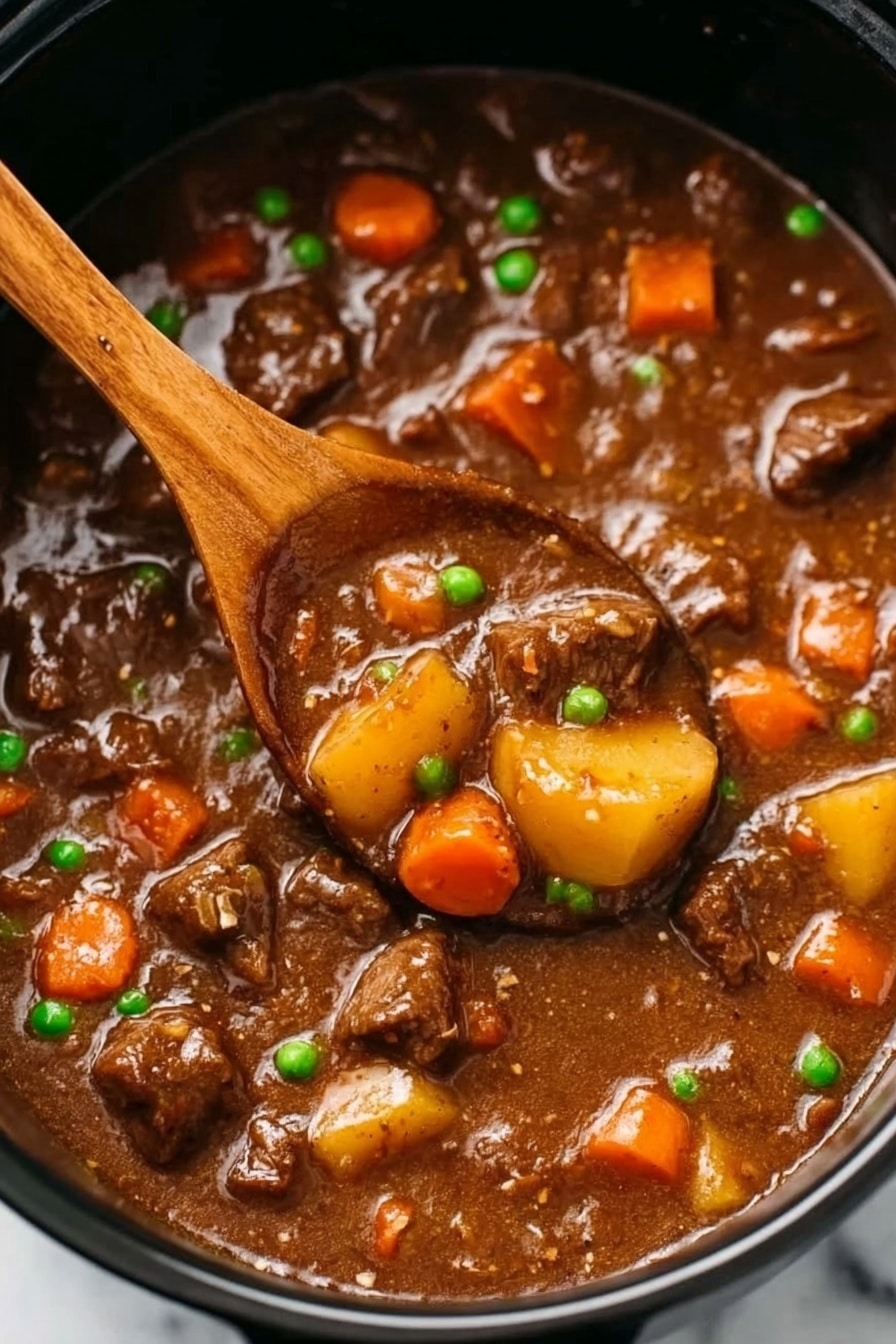 Slow Cooker Beef Stew with Red Wine and Vegetables, comforting beef stew, easy slow cooker recipes, hearty beef stew, cozy dinner ideas - The image shows a close-up of beef stew in a black pot, filled with tender-looking chunks of brown beef, bright orange carrot pieces, small green peas, and yellow baby potatoes all mixed in a thick, glossy brown gravy. In the center, a wooden spoon scoops up some of the stew, revealing the chunky vegetables and meat soaked in rich sauce. The stew surface looks smooth with a hearty, comforting texture. The background is a white marbled surface. photo taken with an iphone --ar 2:3 --v 7