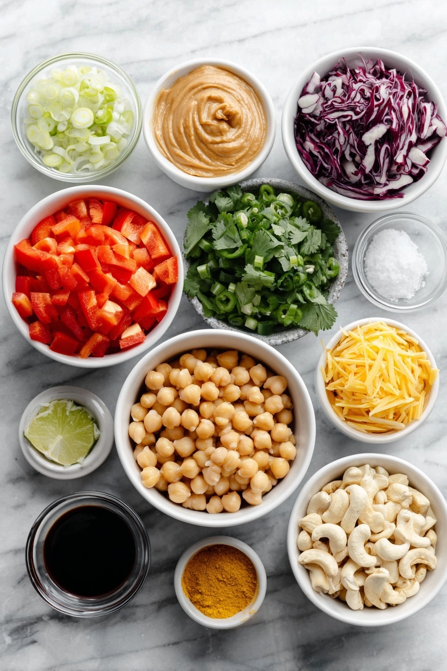 Chopped Thai-Inspired Chickpea Salad with Curry Peanut Dressing, Thai chickpea salad, healthy chickpea salad recipe, vegan Thai salad, quick Asian chickpea salad - Flat lay of a diced red bell pepper, a small mound of shredded bright orange carrots, a heap of chopped deep purple-red cabbage, a simple white ceramic bowl filled with plump rinsed chickpeas, a small pile of fresh cilantro leaves, thinly sliced green onions, a whole green jalapeño pepper with seeds visible, a small white bowl of creamy peanut butter, a small white bowl of freshly grated pale yellow ginger, a small white bowl containing minced white garlic, a small white bowl with fresh lime juice, a small white bowl of dark soy sauce, a small white bowl holding vibrant yellow curry powder, a small white bowl of bright red cayenne pepper powder, a small white bowl of golden ground turmeric, a small white bowl of roasted light brown cashews, all symmetrically arranged on a clean white marble surface, soft natural light, photo taken with an iPhone, professional food photography style, fresh ingredients, white ceramic bowls, no bottles, no duplicates, no utensils, no packaging --ar 2:3 --v 7 --p awthu7i m7354615311229779997