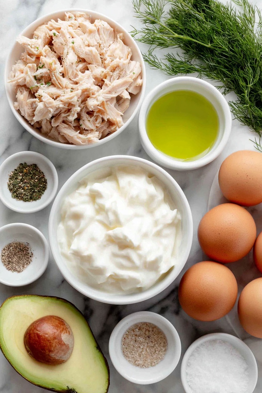 Healthy Greek Yogurt Avocado Chicken Salad, healthy chicken salad, avocado chicken salad, Greek yogurt chicken salad, gluten-free chicken salad - Flat lay of a small pile of shredded cooked chicken, a ripe medium avocado halved to show creamy green flesh and large seed, a small white ceramic bowl filled with thick plain Greek yogurt, a few sprigs of fresh dill, a small white ceramic bowl containing bright green lime juice, a small white ceramic bowl holding fine sea salt, a small white ceramic bowl with ground black pepper, a small white ceramic bowl with onion powder, a small white ceramic bowl with garlic powder, whole uncracked brown eggs arranged neatly aside, all arranged in perfect symmetry on a clean white marble surface, soft natural light, photo taken with an iPhone, professional food photography style, fresh ingredients, white ceramic bowls, no bottles, no duplicates, no utensils, no packaging --ar 2:3 --v 7 --p m7354615311229779997