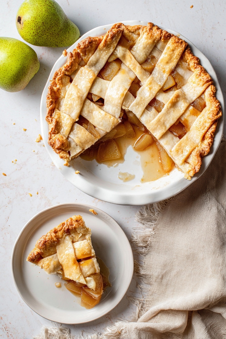 Vegan Pear Pie with Chai Spices, vegan pear pie, chai spice dessert, vegan fruit pie, fall vegan dessert - A round pie with a golden brown lattice crust sits on a white plate, showing a soft, slightly shiny filling of sliced pears and cinnamon sauce underneath. One large slice is missing from the pie, revealing the thick fruit filling and some sauce spilling onto the plate. The crust edges are crimped with a slightly darker golden tone. Next to the pie is a smaller white dish with a single slice of the pie, showing the same layers clearly. The scene is on a white marbled surface, with two whole green pears in the top left corner and a soft beige cloth napkin with frayed edges near the bottom left. photo taken with an iphone --ar 2:3 --v 7