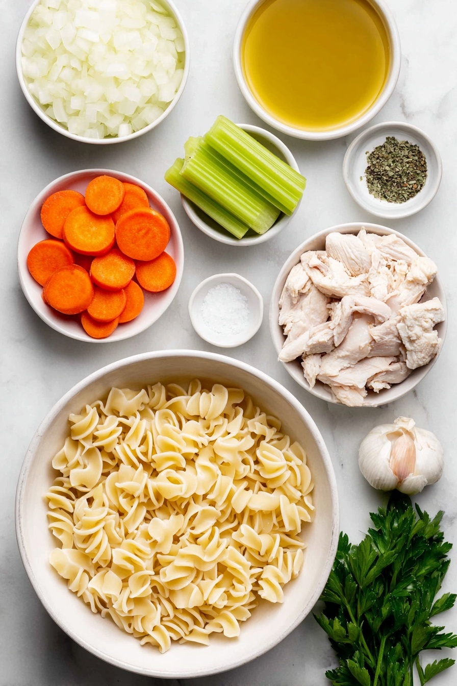 Vegan Chicken Noodle Soup, plant-based chicken noodle soup, vegan comfort food recipes, dairy-free chicken noodle soup, healthy vegan soup recipes - Flat lay of a small white ceramic bowl of golden olive oil, a large white ceramic bowl filled with chopped white onion, a few cloves of whole unpeeled garlic, three bright green celery stalks sliced, three peeled and sliced vibrant orange carrots, a small white ceramic bowl of dried green basil, a small white ceramic bowl of dried thyme, chopped vegan chicken pieces resembling small beige chunks, uncooked gigli pasta with its twisted funnel shape arranged neatly, a small white ceramic bowl of coarse salt crystals, a small white ceramic bowl of cracked black peppercorns, and a small bunch of fresh green parsley sprigs, all placed on a clean white marble surface, soft natural light, photo taken with an iPhone, professional food photography style, fresh ingredients, white ceramic bowls, no bottles, no duplicates, no utensils, no packaging --ar 2:3 --v 7 --p m7354615311229779997