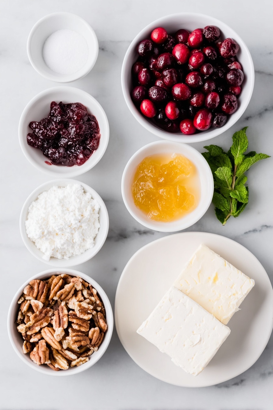 Cranberry Cream Cheese Dip with Pecans, holiday appetizer, easy cranberry dip, creamy fruit dip, festive cheese dip - Flat lay of fresh whole cranberries, a small white bowl of white sugar, a small white bowl of golden apricot preserves, a small white bowl of clear water, a small pile of chopped pecans, two blocks of smooth cream cheese with clean edges, a few buttery crackers, and a sprig of fresh mint, all arranged in perfect symmetry on simple white ceramic dishes and plates, placed on a clean white marble surface, soft natural light, photo taken with an iPhone, professional food photography style, fresh ingredients, white ceramic bowls, no bottles, no duplicates, no utensils, no packaging --ar 2:3 --v 7 --p m7354615311229779997