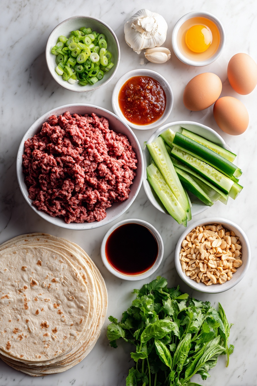 Thai Basil Beef Rolls, Thai Basil Beef Wraps, Thai Beef Lettuce Wraps, Easy Thai Beef Appetizer, Quick Thai Beef Snacks - Flat lay of fresh ground beef in a simple white ceramic bowl, whole uncracked brown eggs beside it, four cloves of peeled garlic, a small mound of freshly grated ginger root, a small white bowl of dark tamari sauce, a small white bowl of bright red Thai chili sauce, two chopped green onions with white and green parts visible, four Persian cucumbers chopped into rounds, a bunch of vibrant green cilantro leaves, a small bunch of deep green Thai basil leaves, a small white bowl filled with chopped roasted peanuts, a stack of warm flour tortillas neatly arranged, a small white bowl of chili paste, and a small white bowl of toasted sesame oil all evenly spaced with perfect symmetry placed on a clean white marble surface, soft natural light, photo taken with an iPhone, professional food photography style, fresh ingredients, white ceramic bowls, no bottles, no duplicates, no utensils, no packaging --ar 2:3 --v 7 --p m7354615311229779997